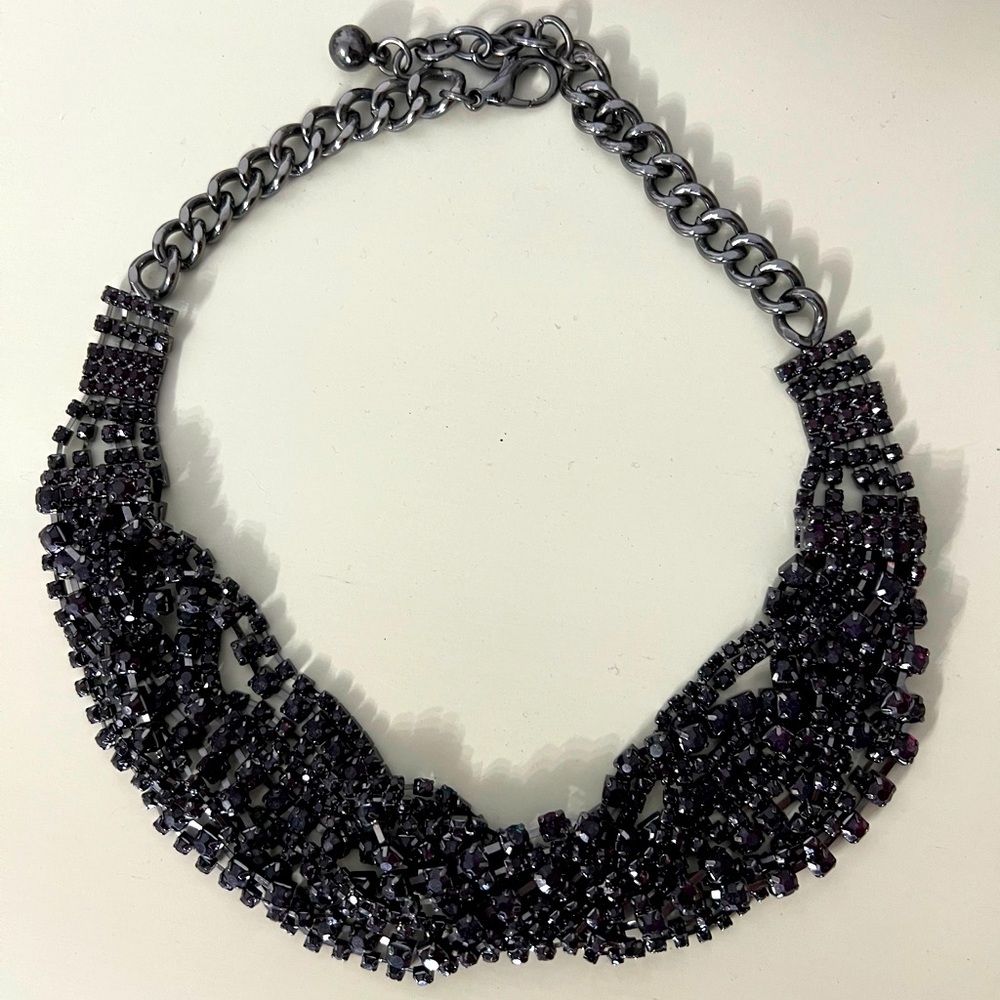 Statement necklace. Gunmetal with reddish black stones.